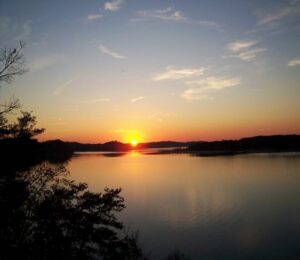 Lake view of a sunset over the mountains